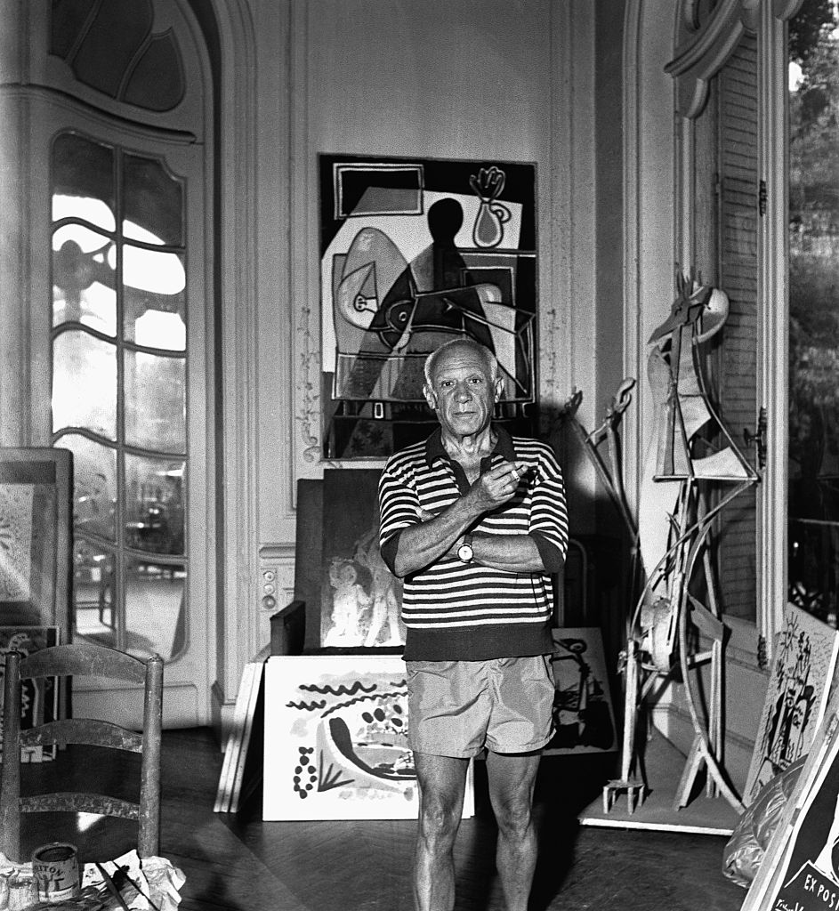 Spanish painter Pablo Piccasso, surrounded by artworks, at his villa La Californie in Cannes in 1955