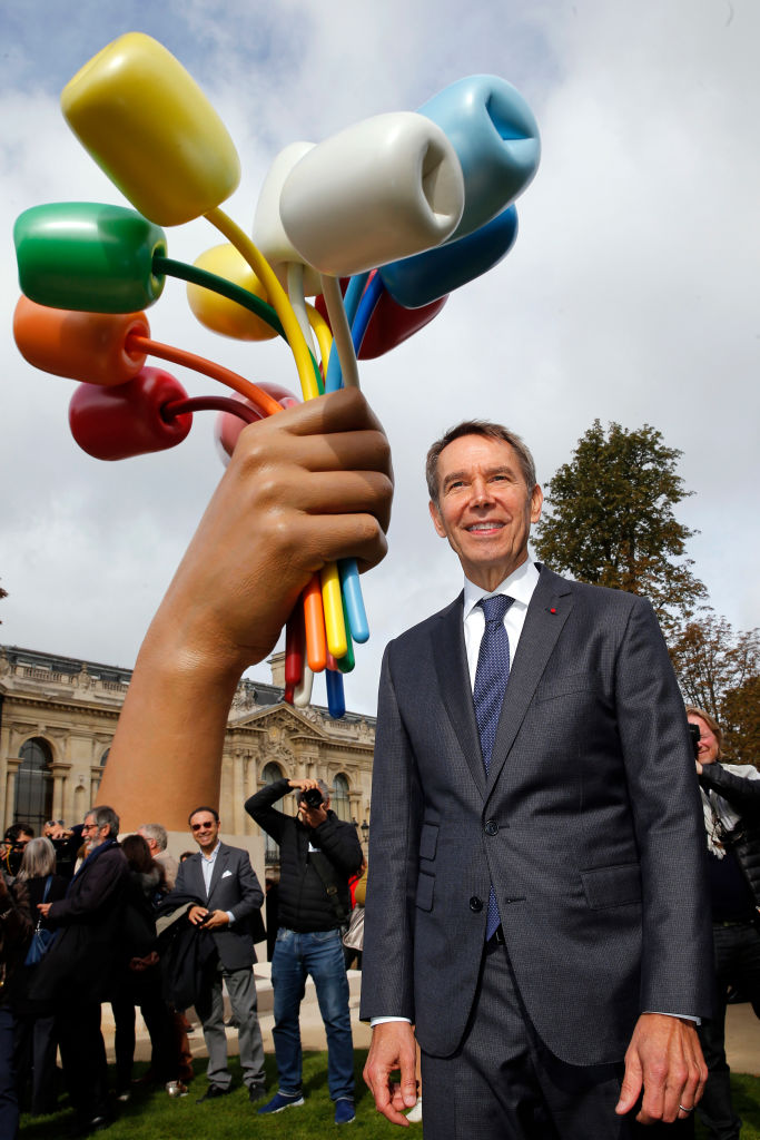 Artist Jeff Koons poses with his sculpture “Tulips” in front of Christie’s at Rockefeller Plaza on November 6, 2012 in New York City