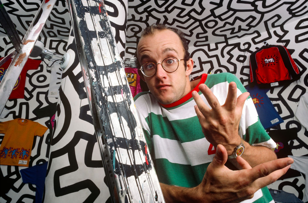 Graffiti artist Keith Haring, known for his squiggly doodles of dogs and humans poses for a portrait in September 1986 in New York City